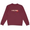 femme qui porte un pull thilelli liberte 100% coton bio, écrit en langue tifinagh, la langue des berbères amazigh par Azamoul mode et accessoires berbères,  de couleur bordeaux