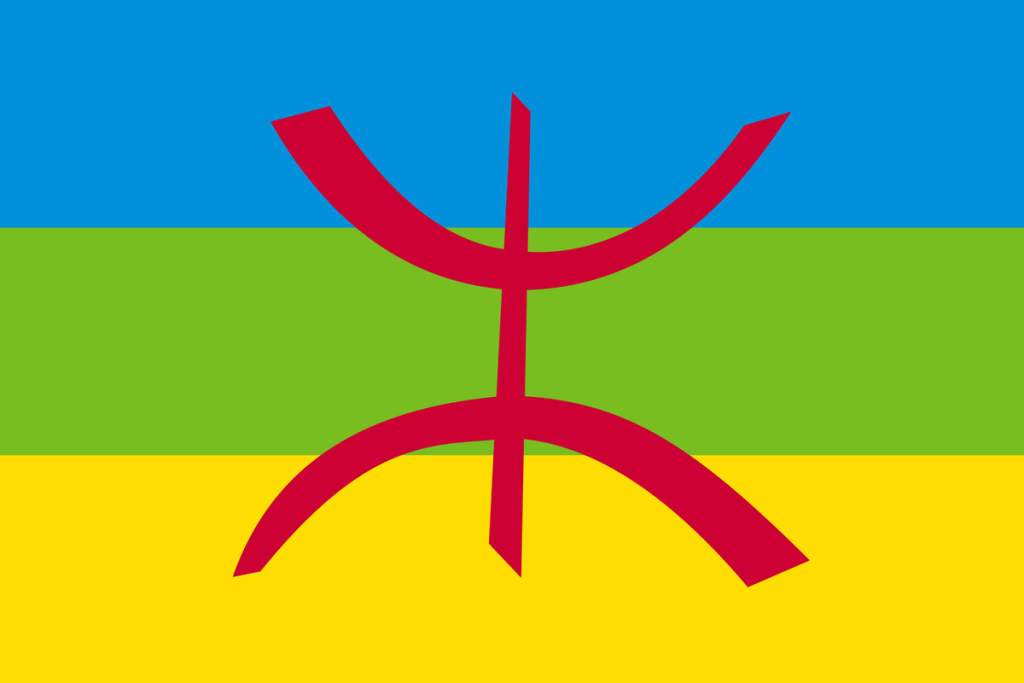 Le drapeau amazigh : bandes bleue, verte et jaune et Yaz ⵣ rouge